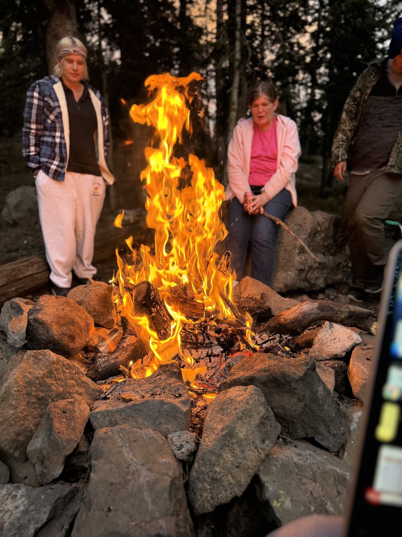 Residents gathered around an evening campfire